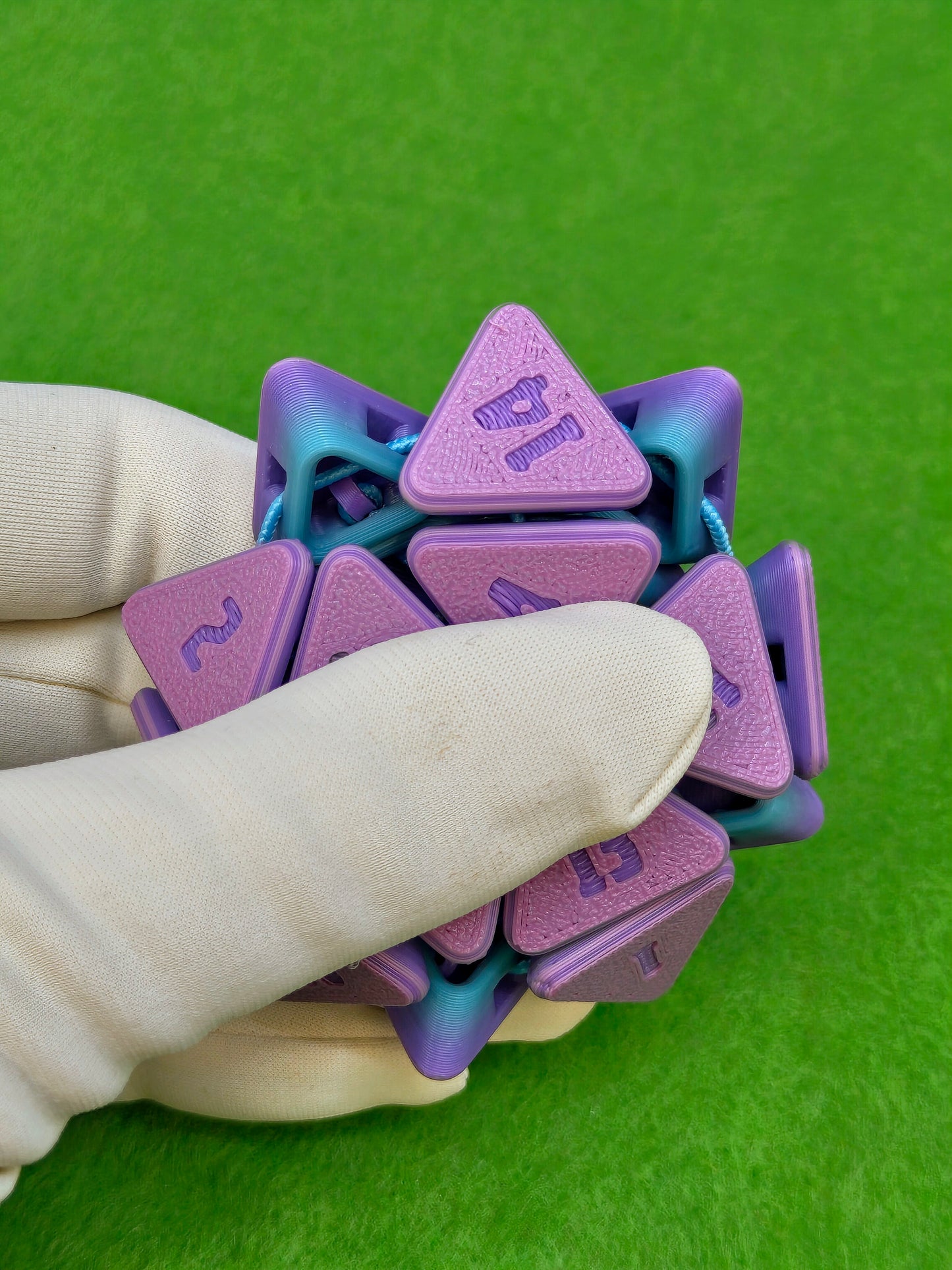 3D printed squishable D20 dice for Dungeons & Dragons and tabletop RPG sessions – soft fidget dice perfect for stress relief and gamer gifts, available in mystery colours for Pathfinder, D&D campaigns, and other roleplaying games.