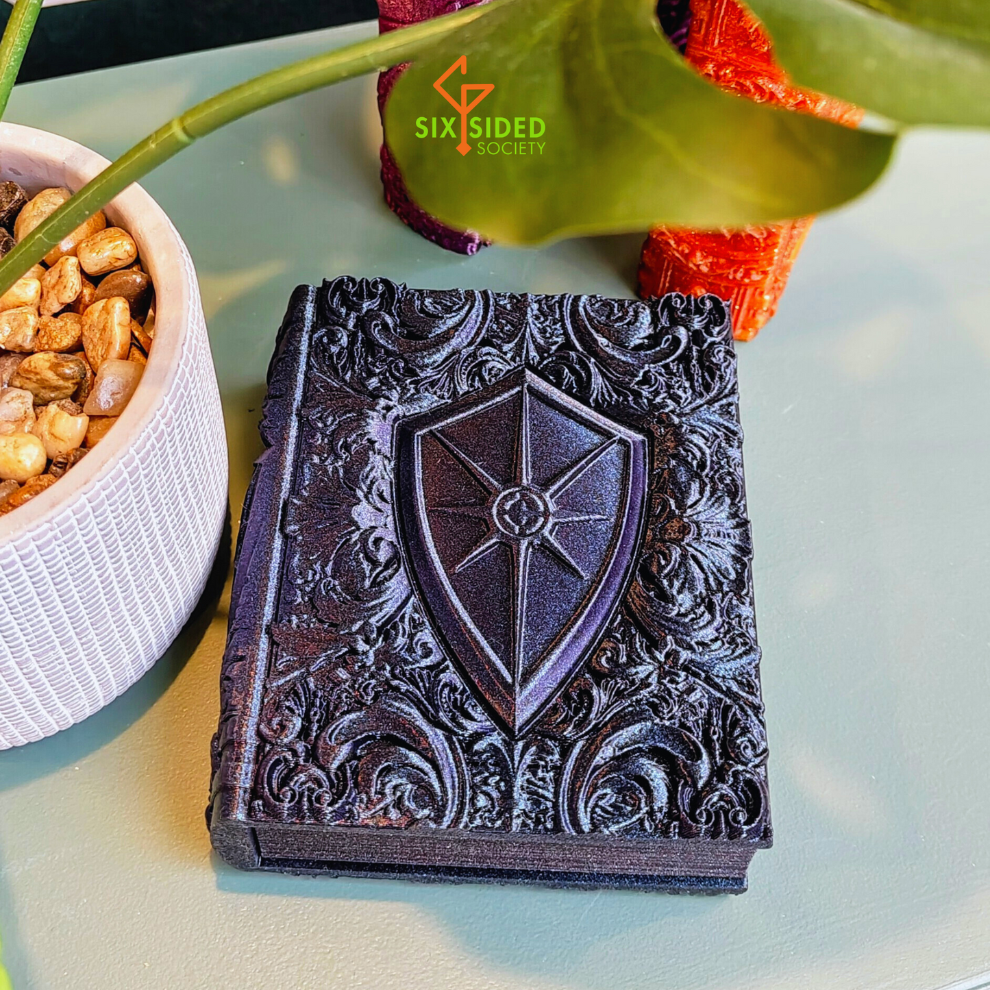 3D-printed book-shaped trinket box for tabletop gaming dice, miniatures, and cards – perfect Dungeons & Dragons storage solution with magnetic closure and nature-inspired design, ideal for RPG players and collectors in Coventry.