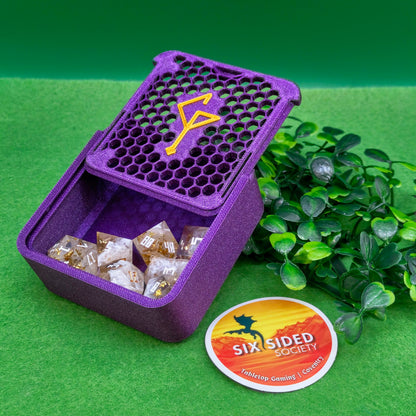 Purple dice container with dice and a 'Six Sided Society' logo on a green background. 3D-printed D20 dice trinket box by Six Sided Society, tabletop gaming storage for Dungeons & Dragons, RPG dice organizer, eco-friendly gift box for dice collectors and dungeon masters, perfect accessory for board games and role-playing sessions